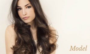 Model with smooth face and flowing long brown hair