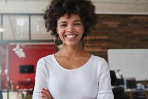 Happy black woman with smooth skin bright smile sculpted neck